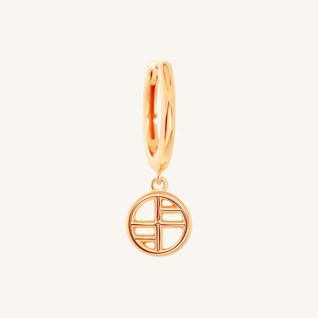 A  rose-tone drop earring with the francesca logo