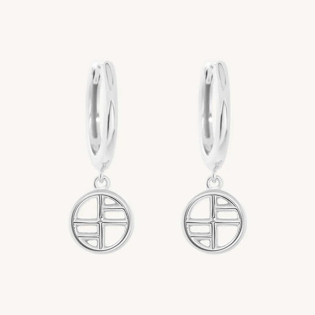 A pair of silver-tone drop earrings with the francesca logo